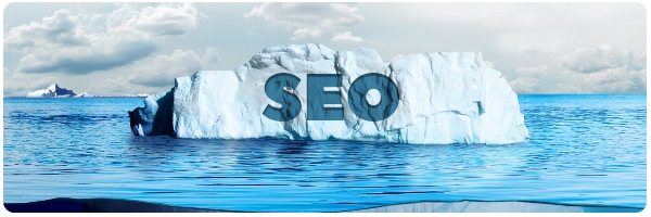 Iceberg with SEO etched into the side, floating in arctic blue water